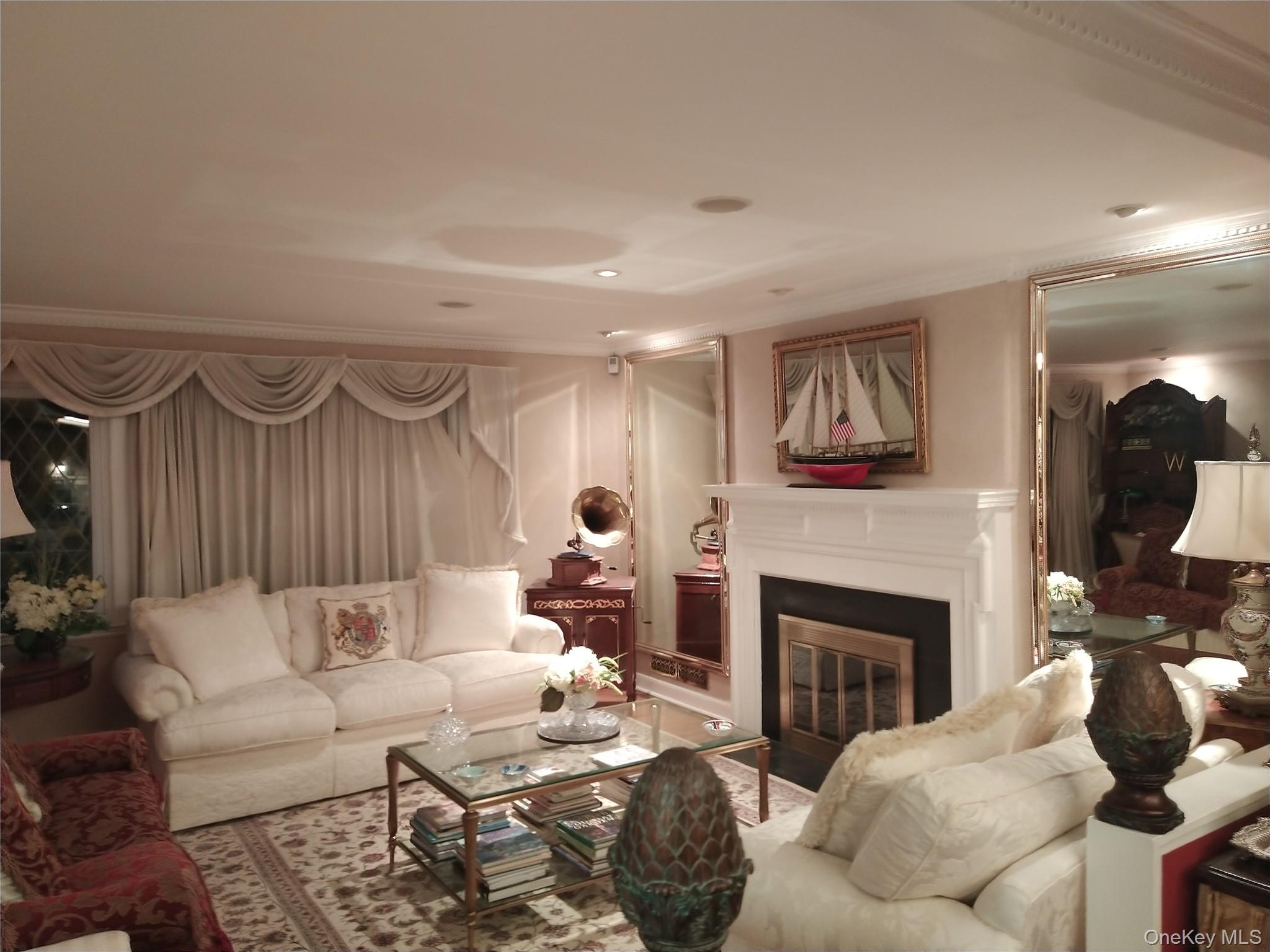 1155 Webster Avenue New Rochelle, NY 10804 - Photo 8 of 35 a living room with furniture and a fireplace