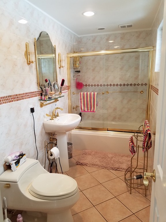 85 Birch Road Longmeadow, MA 01106 - Photo 13 of 26 a bathroom with a sink mirror vanity and toilet