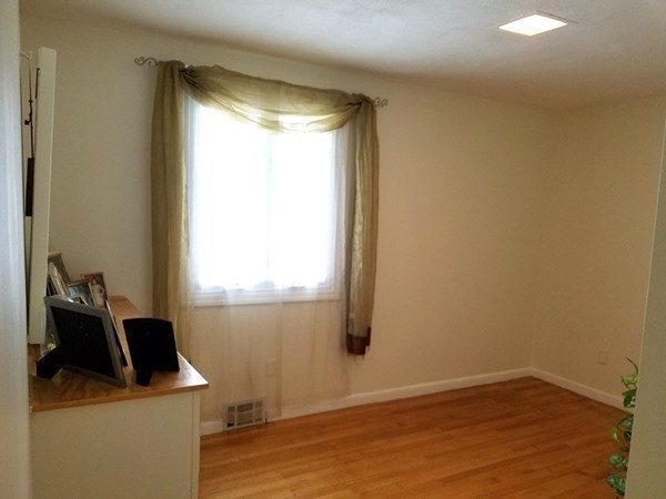 85 Birch Road Longmeadow, MA 01106 - Photo 21 of 26 a room with a window and wooden floor
