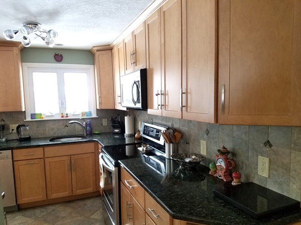 85 Birch Road Longmeadow, MA 01106 - Photo 8 of 26 a kitchen with a sink and cabinets