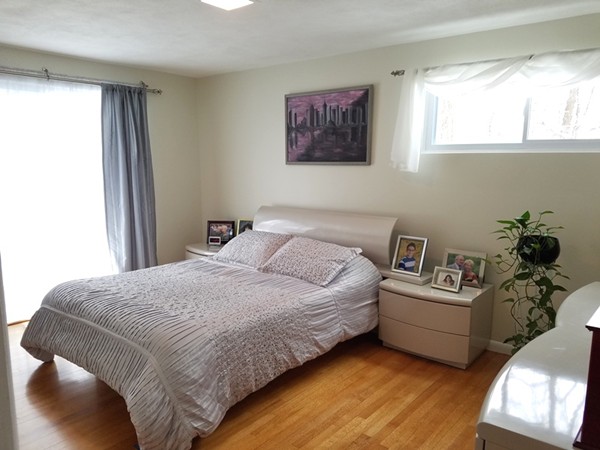 85 Birch Road Longmeadow, MA 01106 - Photo 10 of 26 a spacious bedroom with a bed and a window