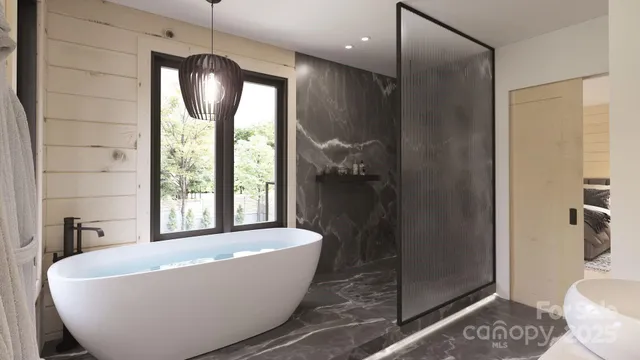 a white bath tub sitting in a bathroom next to a window