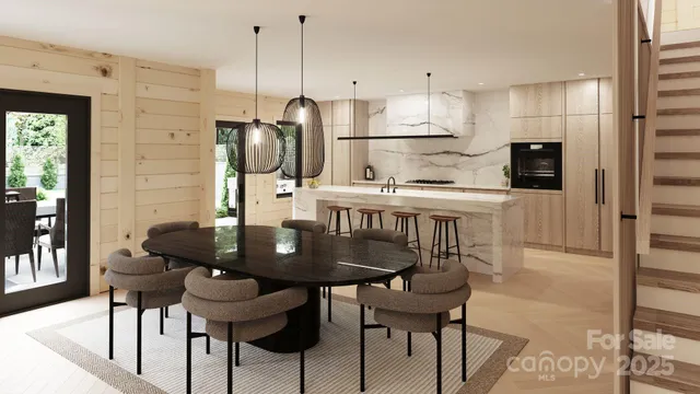 a kitchen with stainless steel appliances kitchen island granite countertop a dining table chairs and a refrigerator