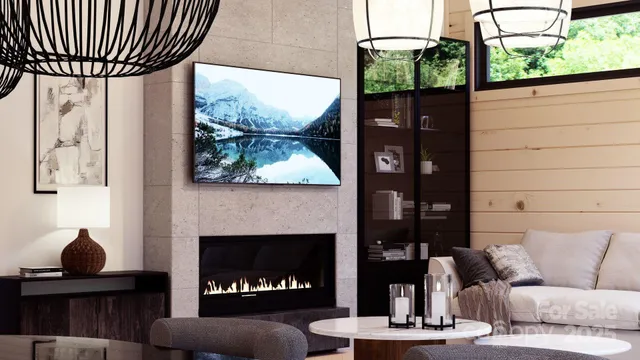 a living room with furniture a fireplace and a floor to ceiling window