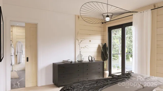 a view of a hallway with a large window and chandelier
