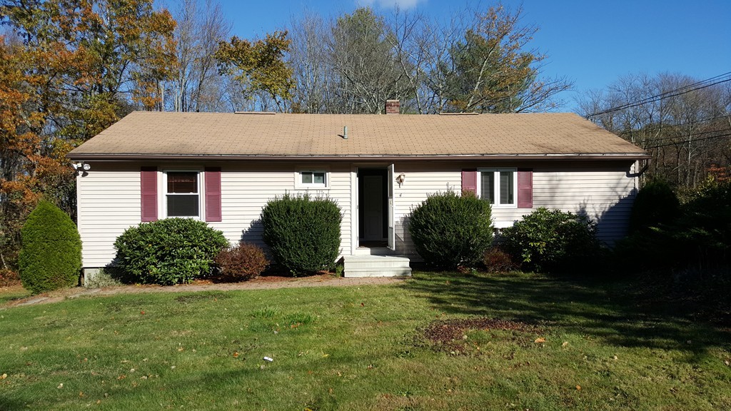 a view of a house with garden and yard
