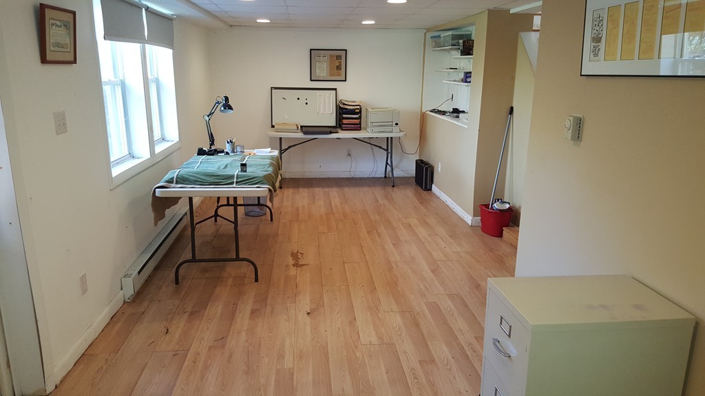 4 Sovereign Heights Sutton, MA 01590 - Photo 14 of 16 a room with wooden floor and furniture