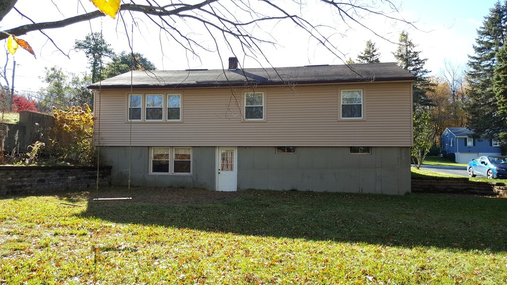 4 Sovereign Heights Sutton, MA 01590 - Photo 3 of 16 a view of a house with a yard