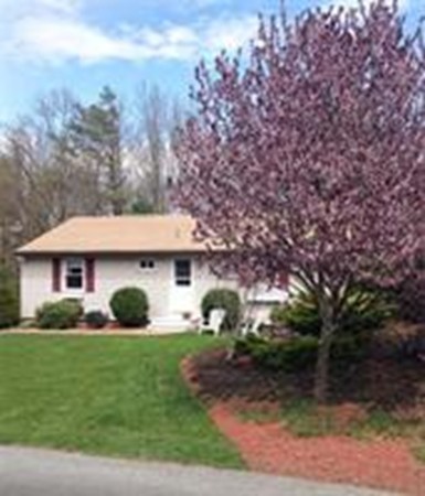4 Sovereign Heights Sutton, MA 01590 - Photo 5 of 16 a front view of a house with garden