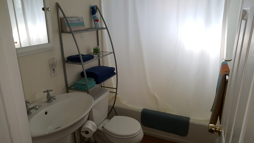 4 Sovereign Heights Sutton, MA 01590 - Photo 9 of 16 a bathroom with a sink a toilet and a mirror