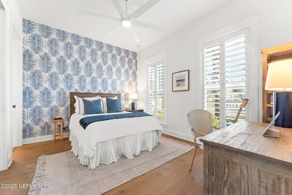 a bathroom with a double vanity sink a bathtub and a shower