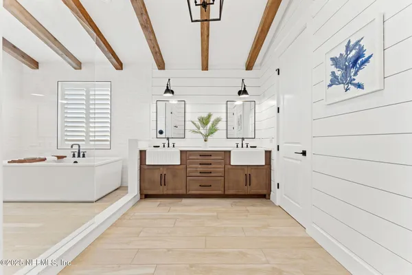 a bedroom with a bed and a table