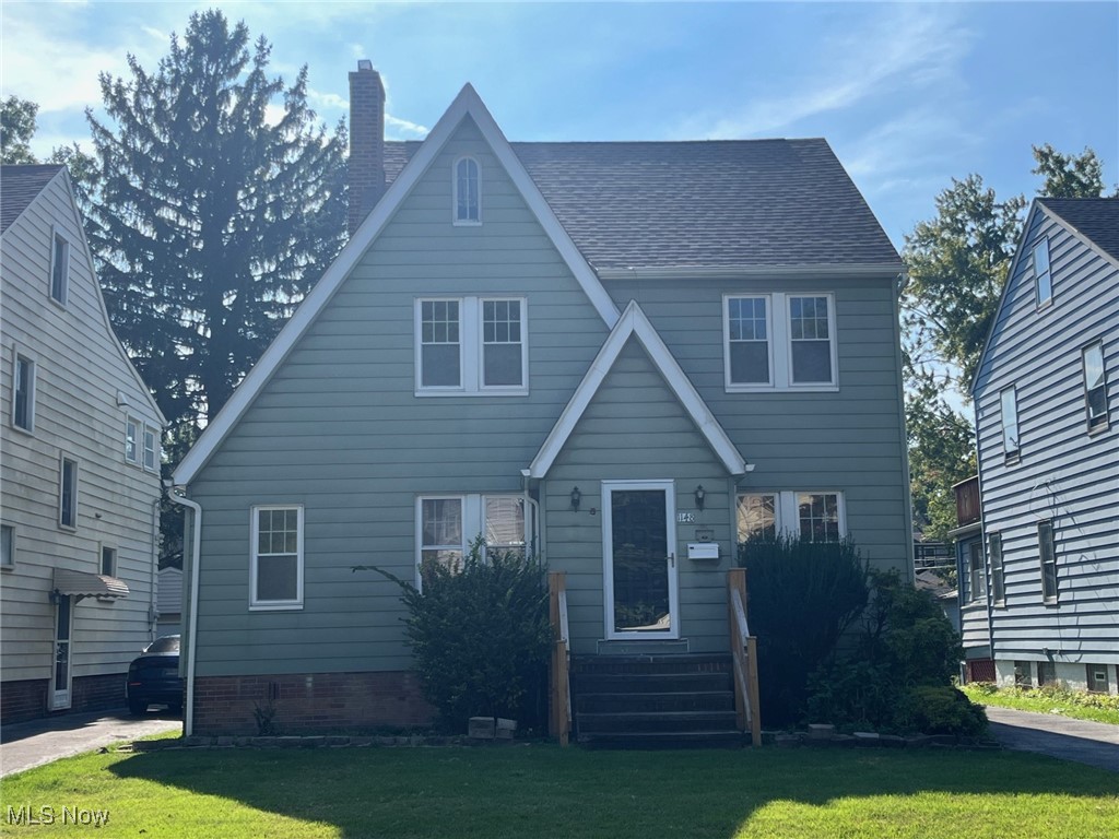 1148 Sylvania Road Cleveland Heights, OH 44121 - Photo 2 of 30 View of front of home with a chimney and a front lawn