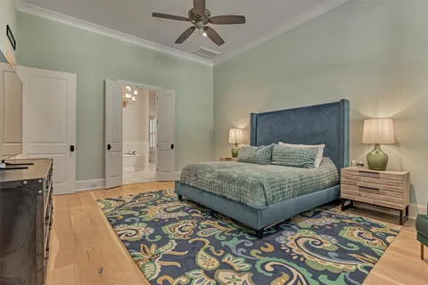a spacious bathroom with a double vanity sink mirror and bathtub