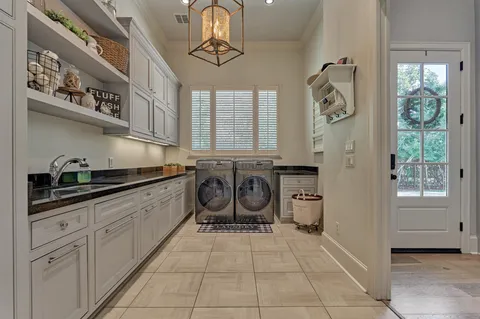 a view of a hallway with workspace and wooden floor