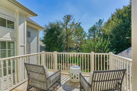 a bedroom with bed and a chandelier