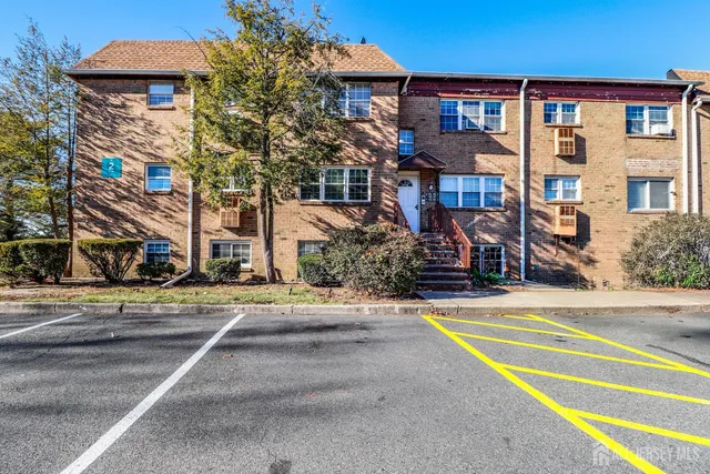 a front view of a building with street view