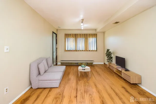 a spacious bedroom with a bed and a couch