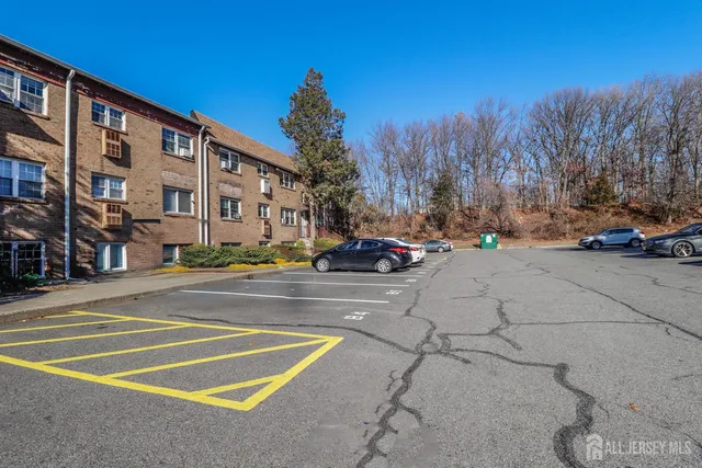 a view of city street with a parked cars