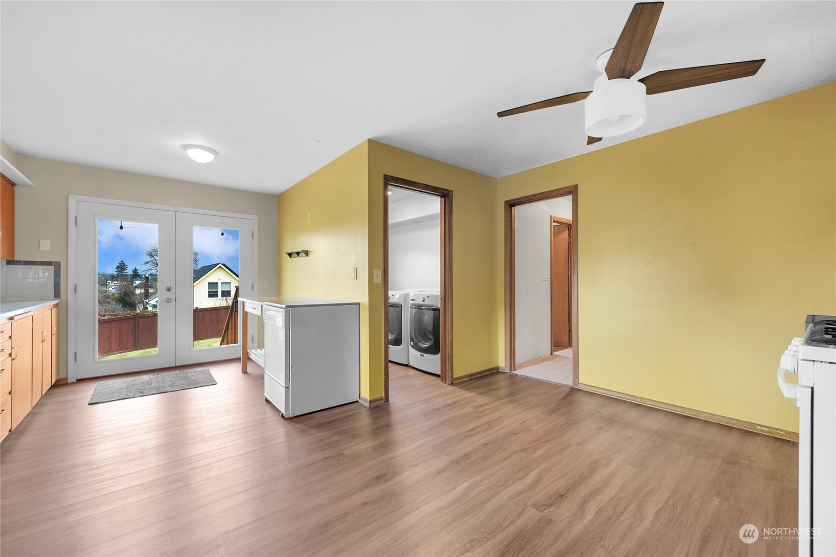 2101 Rockefeller Avenue Everett, WA 98201 - Photo 12 of 26 a view of a big room with wooden floor and windows