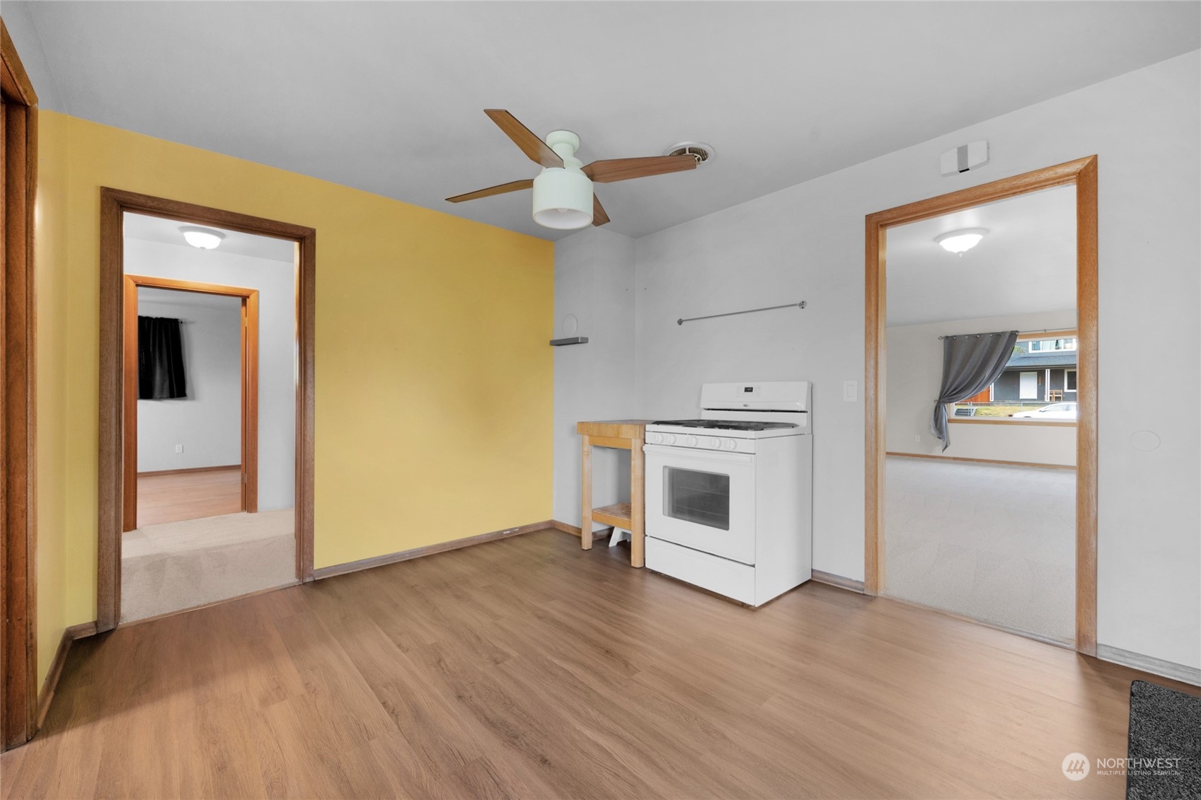 2101 Rockefeller Avenue Everett, WA 98201 - Photo 13 of 26 a view of a hallway with wooden floor and a fireplace