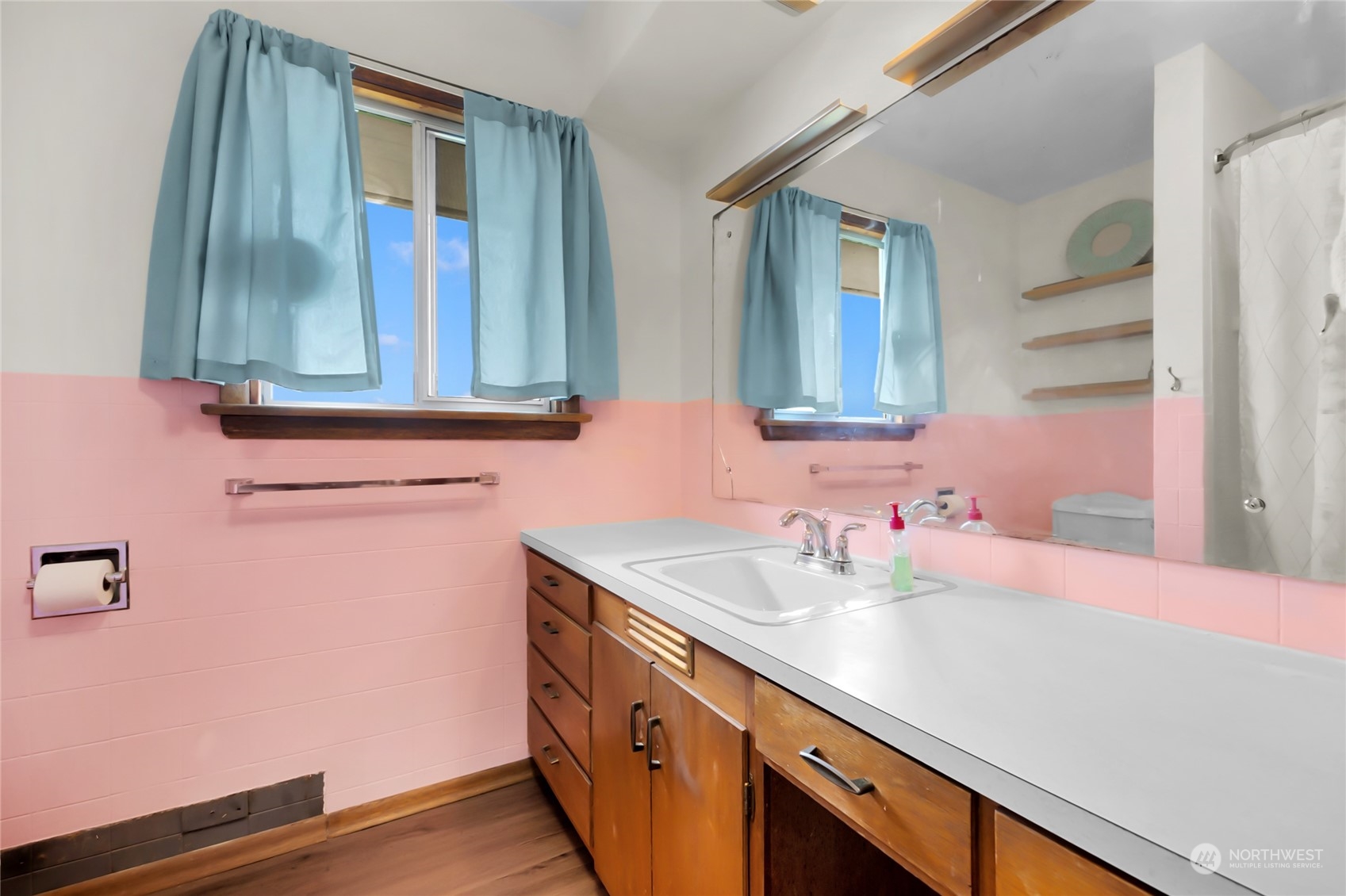2101 Rockefeller Avenue Everett, WA 98201 - Photo 16 of 26 a bathroom with a sink and a mirror