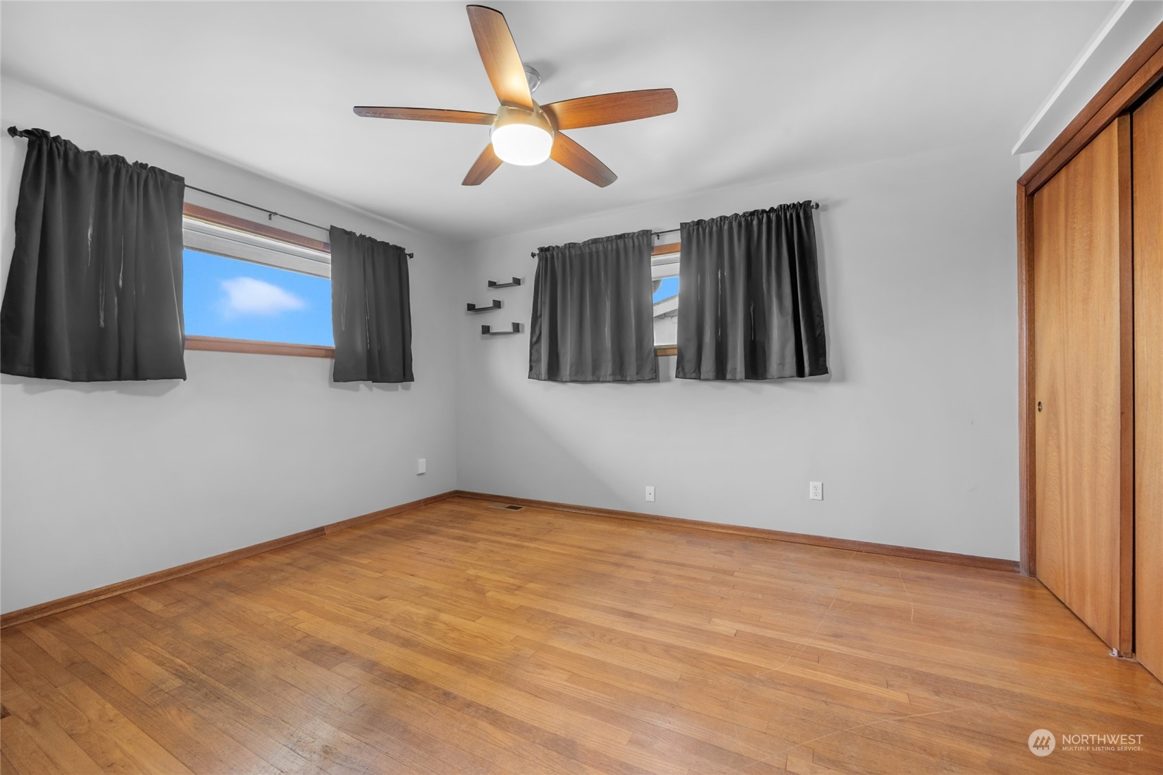 2101 Rockefeller Avenue Everett, WA 98201 - Photo 18 of 26 an empty room with closet and fan