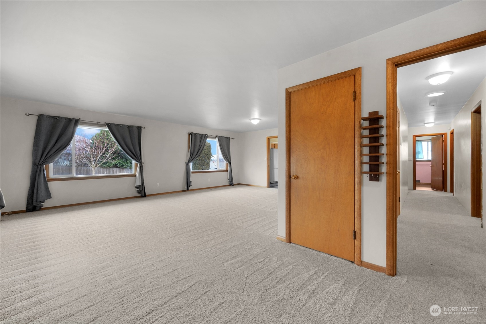 2101 Rockefeller Avenue Everett, WA 98201 - Photo 4 of 26 a view of empty room with wooden floor and window