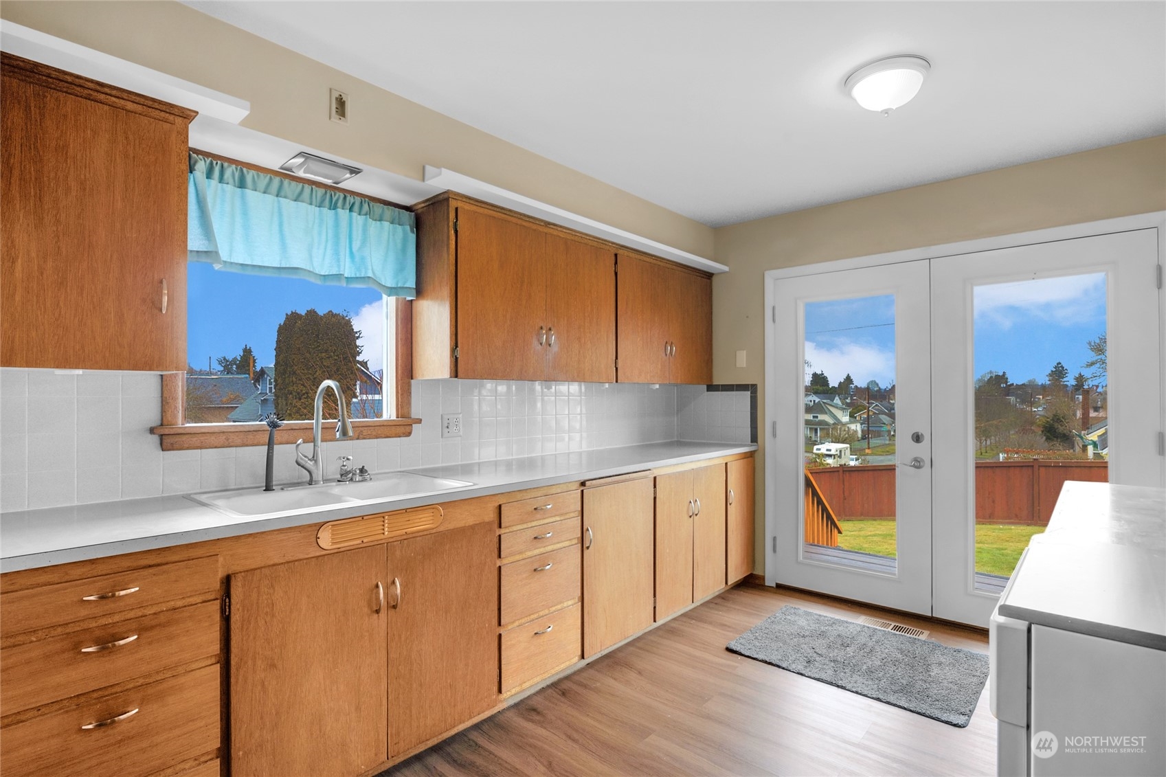 2101 Rockefeller Avenue Everett, WA 98201 - Photo 9 of 26 a kitchen with stainless steel appliances granite countertop a sink and cabinets