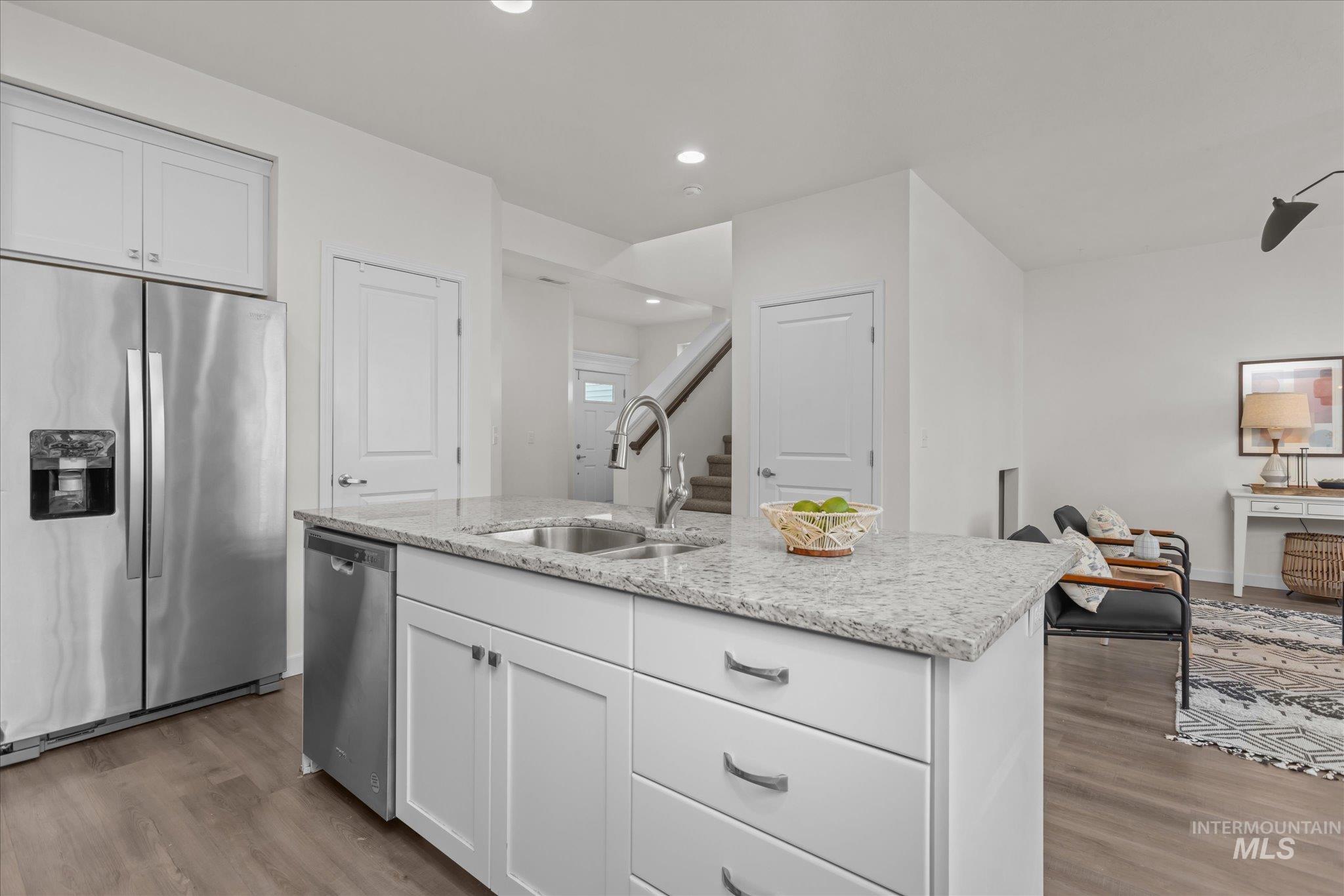 1885 North Justin Avenue Meridian, ID 83646 - Photo 14 of 27 Kitchen with stainless steel appliances, white cabinets, dark wood-type flooring, and recessed lighting