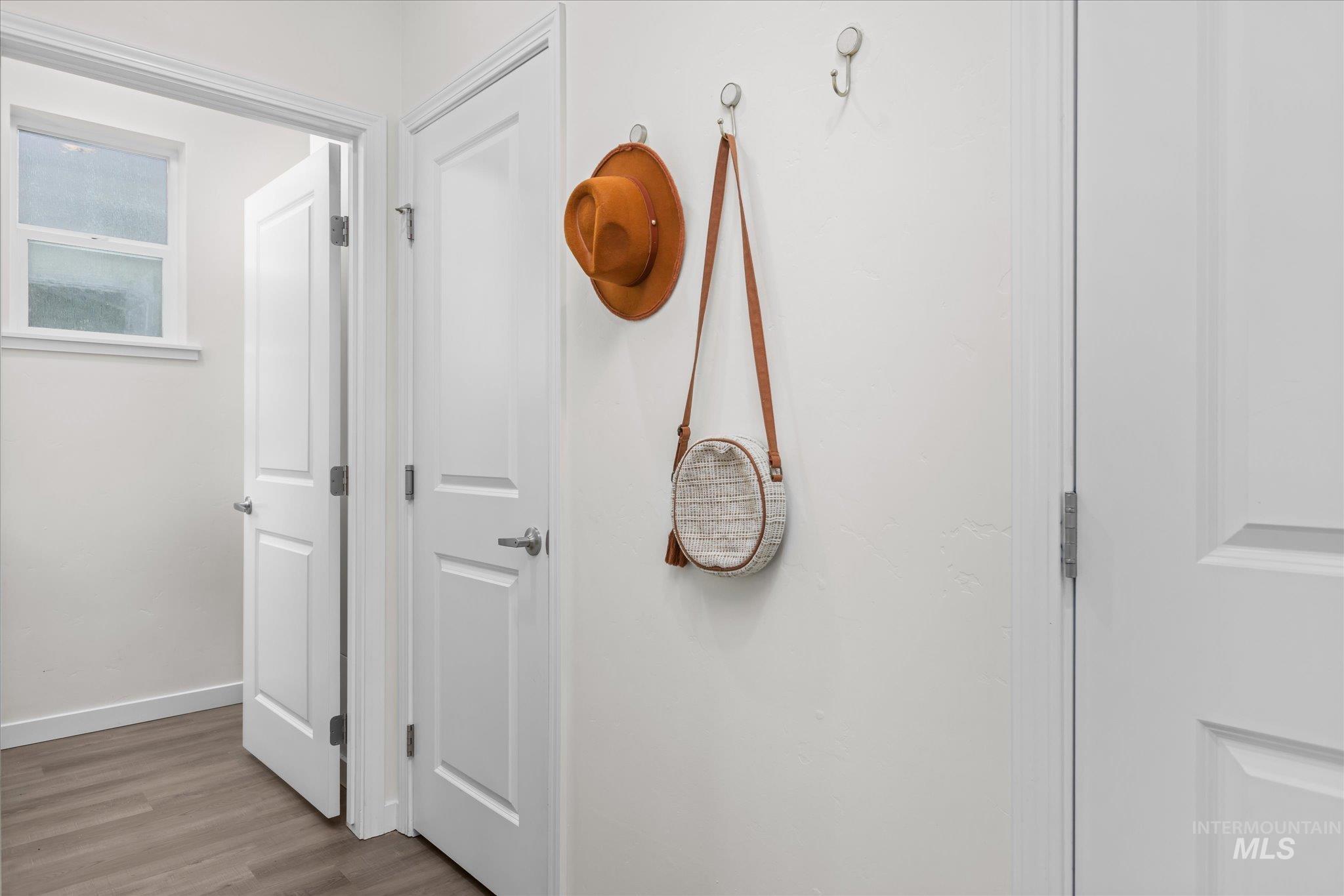 1885 North Justin Avenue Meridian, ID 83646 - Photo 16 of 27 Hall featuring wood finished floors and baseboards