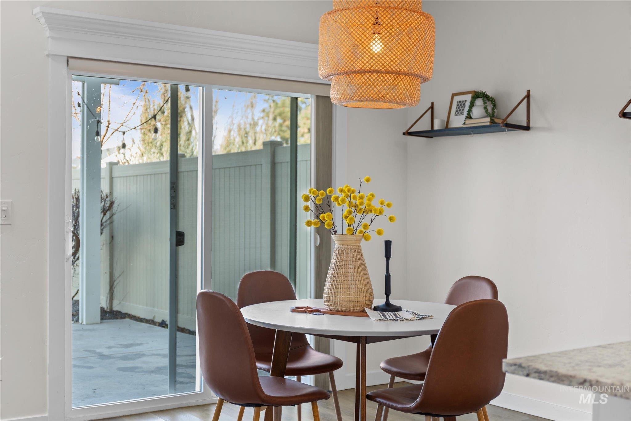 1885 North Justin Avenue Meridian, ID 83646 - Photo 22 of 27 Dining area with light wood-type flooring and baseboards