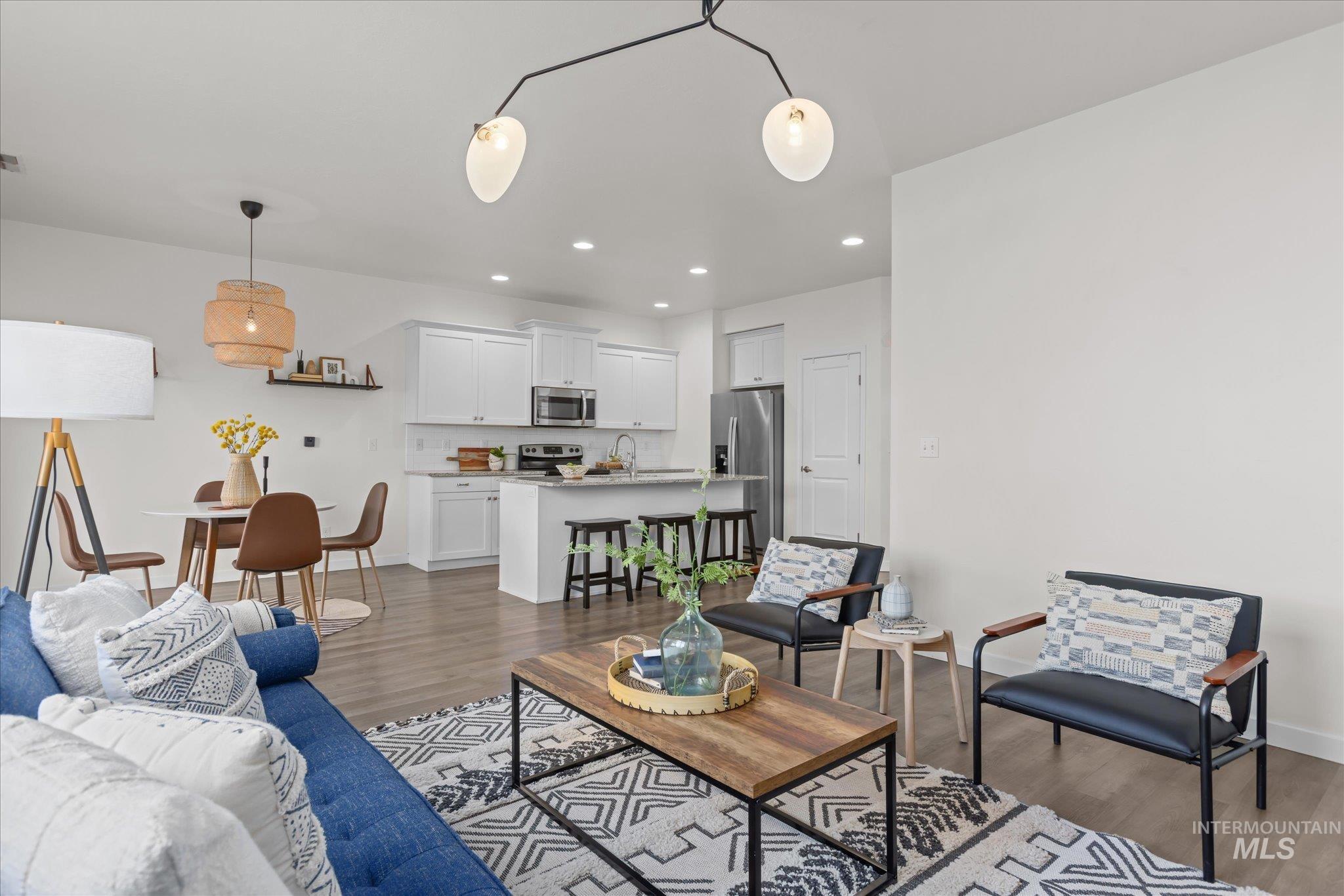 1885 North Justin Avenue Meridian, ID 83646 - Photo 6 of 27 Living area featuring dark wood finished floors and recessed lighting