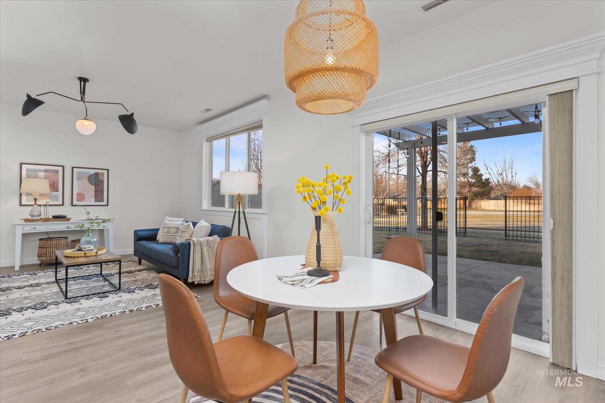 1885 North Justin Avenue Meridian, ID 83646 - Photo 8 of 27 Dining space featuring light wood-style floors and baseboards