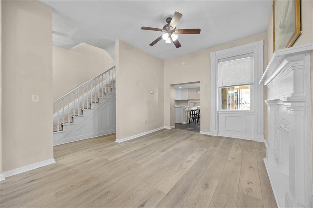 1312 Boyle Street Pittsburgh, PA 15212 - Photo 12 of 50 a view of an empty room with wooden floor and a window