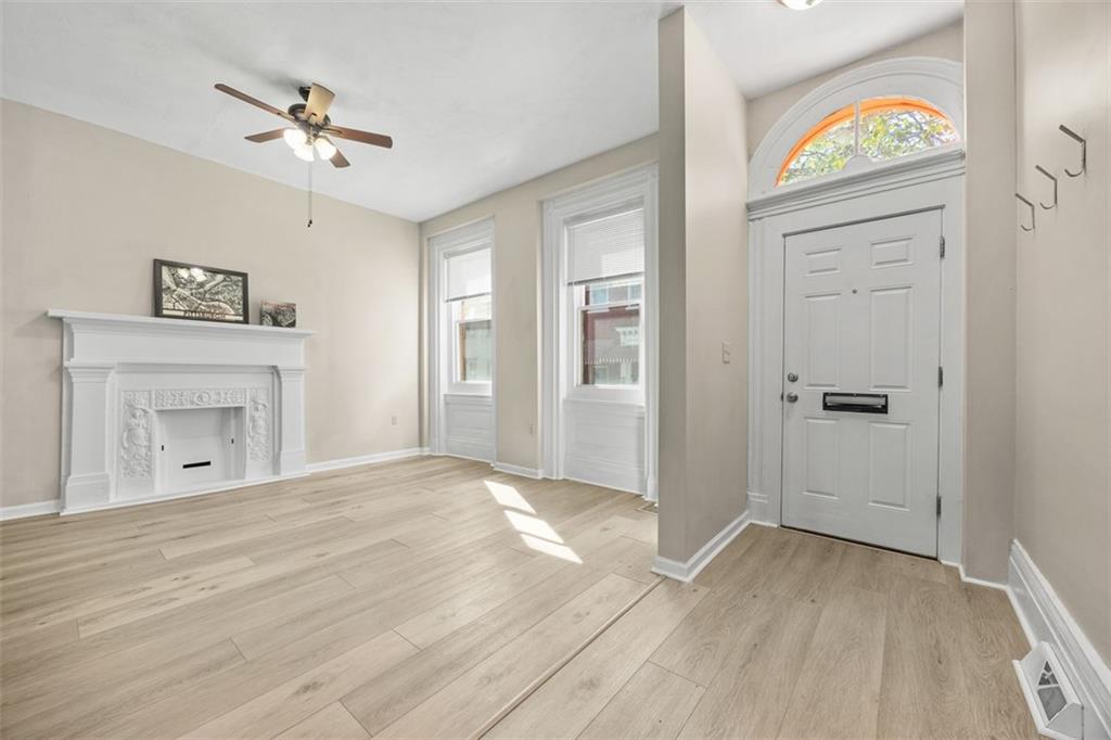 1312 Boyle Street Pittsburgh, PA 15212 - Photo 14 of 50 an empty room with windows and ceiling fan