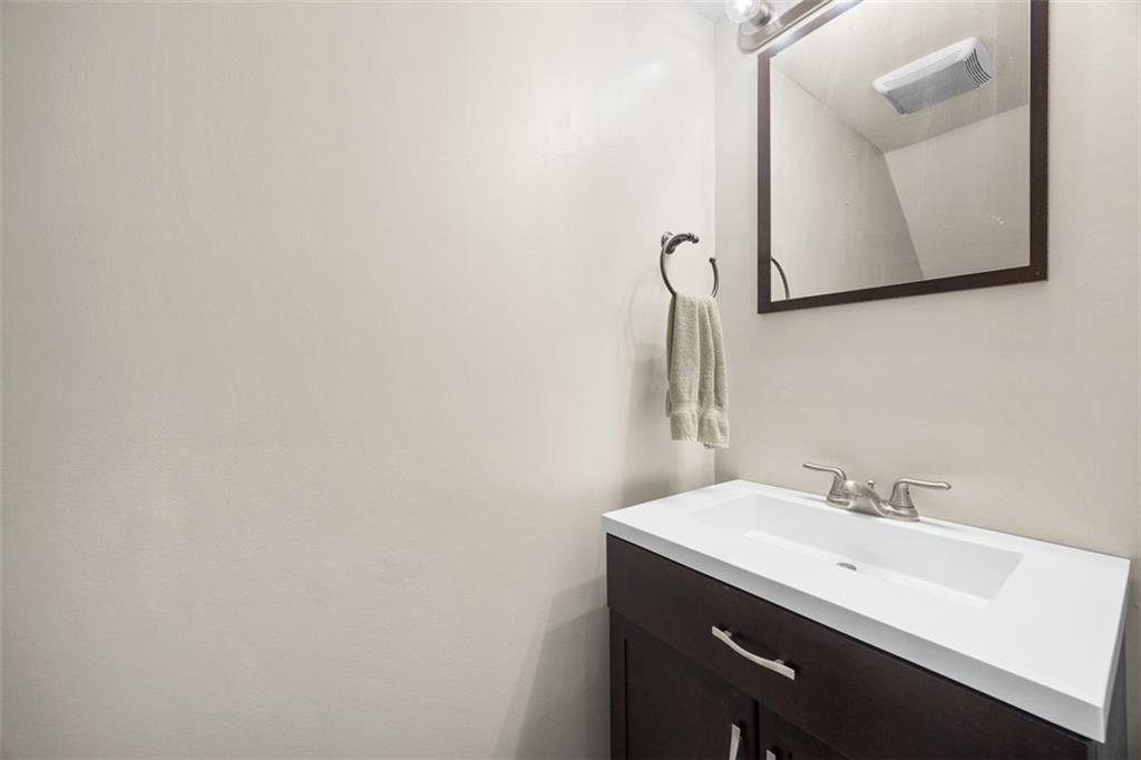 1312 Boyle Street Pittsburgh, PA 15212 - Photo 19 of 50 a bathroom with a sink and a mirror