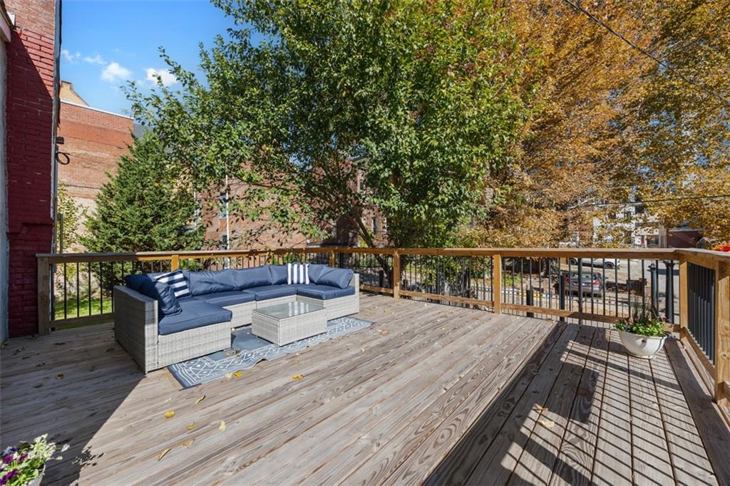1312 Boyle Street Pittsburgh, PA 15212 - Photo 22 of 50 a view of a roof deck with wooden floor and fence
