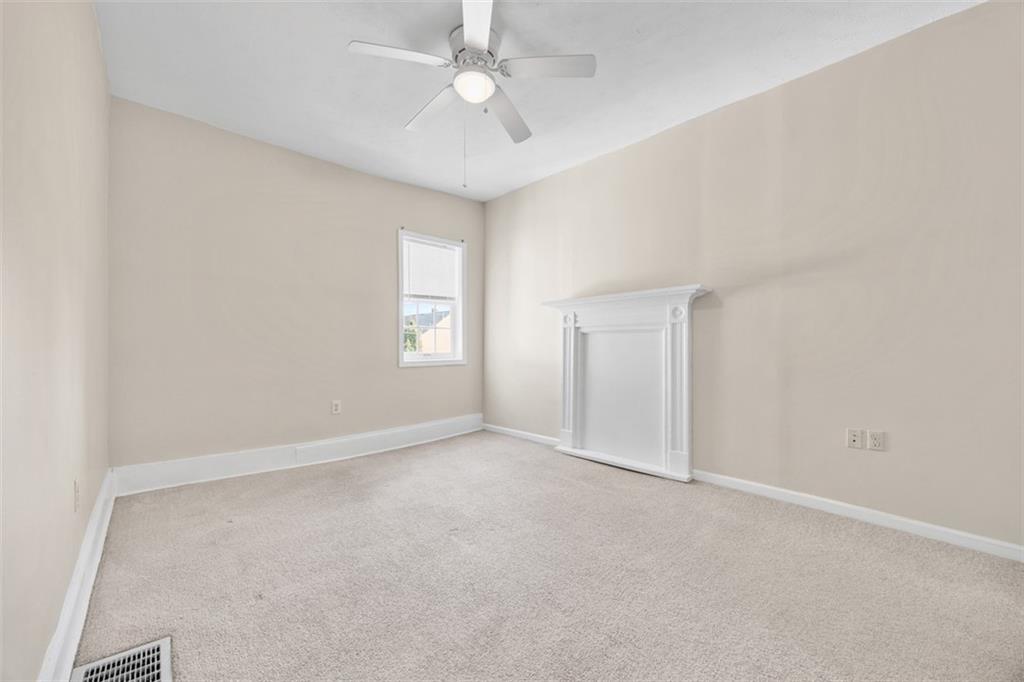 1312 Boyle Street Pittsburgh, PA 15212 - Photo 30 of 50 an empty room with windows and fan