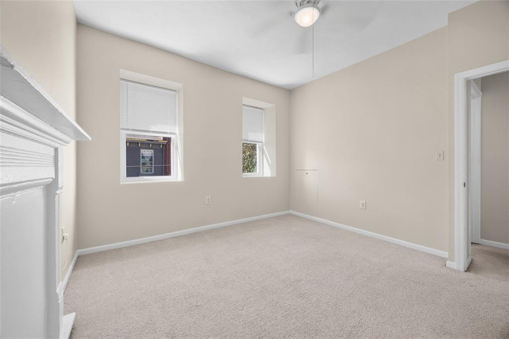 1312 Boyle Street Pittsburgh, PA 15212 - Photo 33 of 50 an empty room with windows and fan