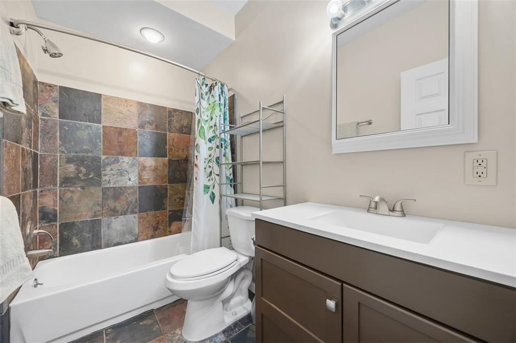 1312 Boyle Street Pittsburgh, PA 15212 - Photo 34 of 50 a bathroom with a sink a toilet and shower