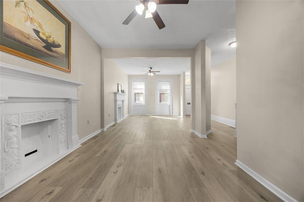 1312 Boyle Street Pittsburgh, PA 15212 - Photo 10 of 50 a view of an empty room with a fireplace and a window