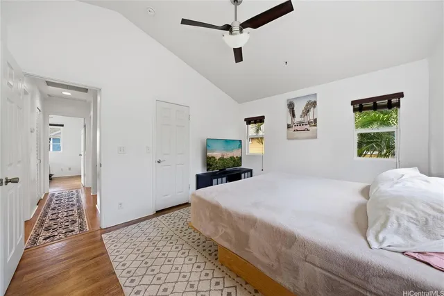 a bedroom with a large bed and a window