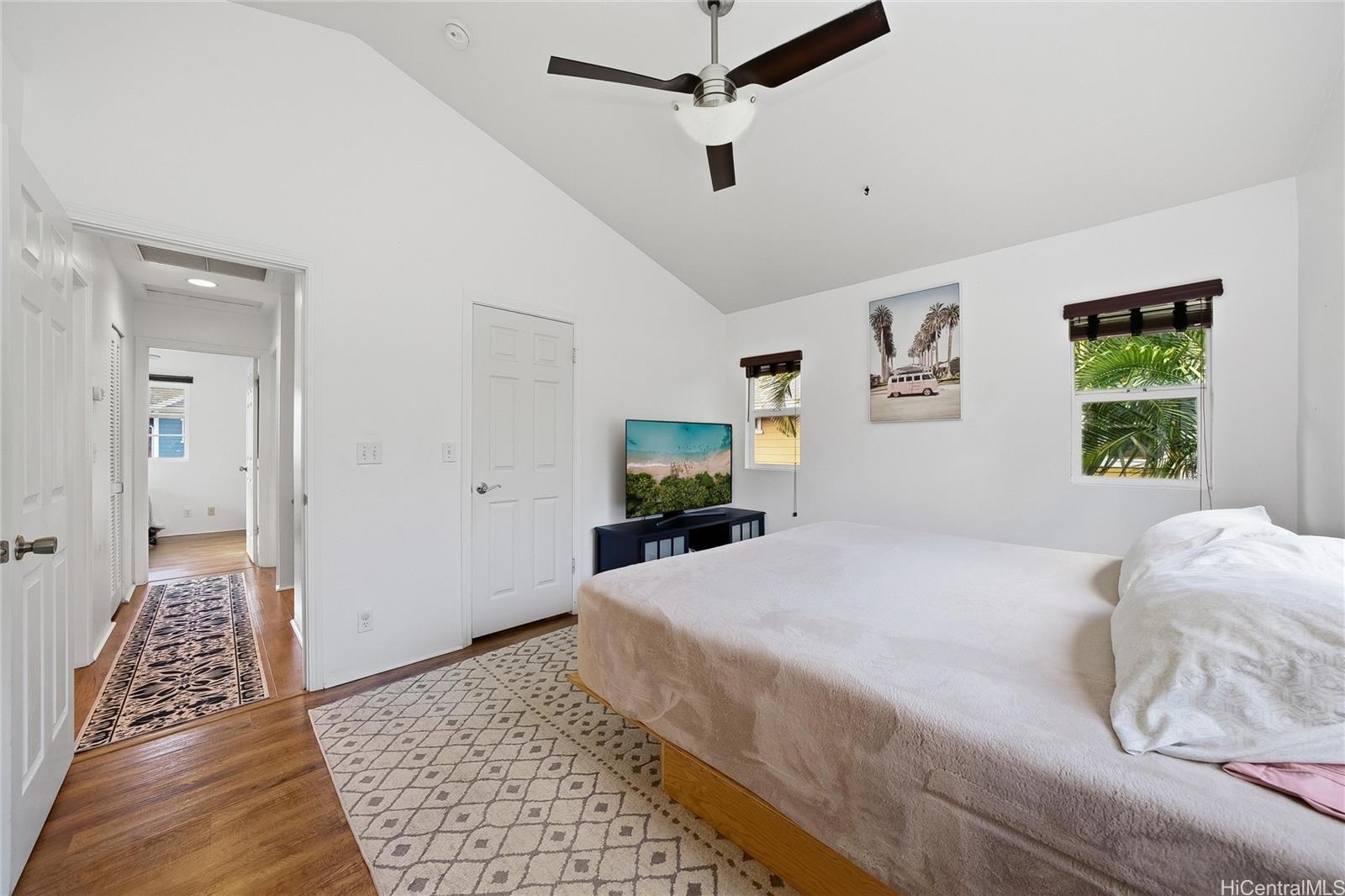 87-1958 Pakeke Street, Unit T Waianae, HI 96792 - Photo 14 of 25 a bedroom with a large bed and a window