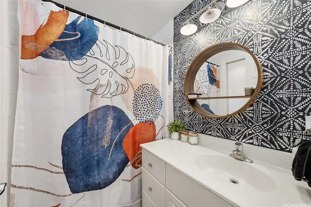 a bathroom with a sink and mirror