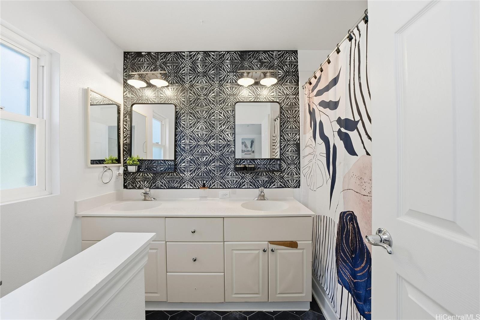 87-1958 Pakeke Street, Unit T Waianae, HI 96792 - Photo 16 of 25 a bathroom with a sink and a mirror