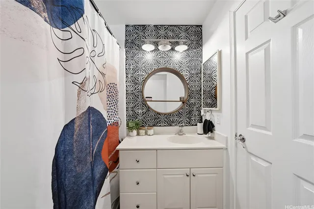 a bathroom with a sink and a mirror