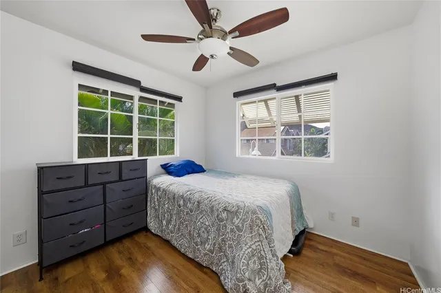 a bed room with a bed and a window