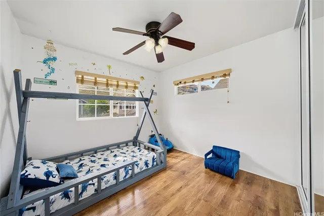 a bedroom with bed and a window