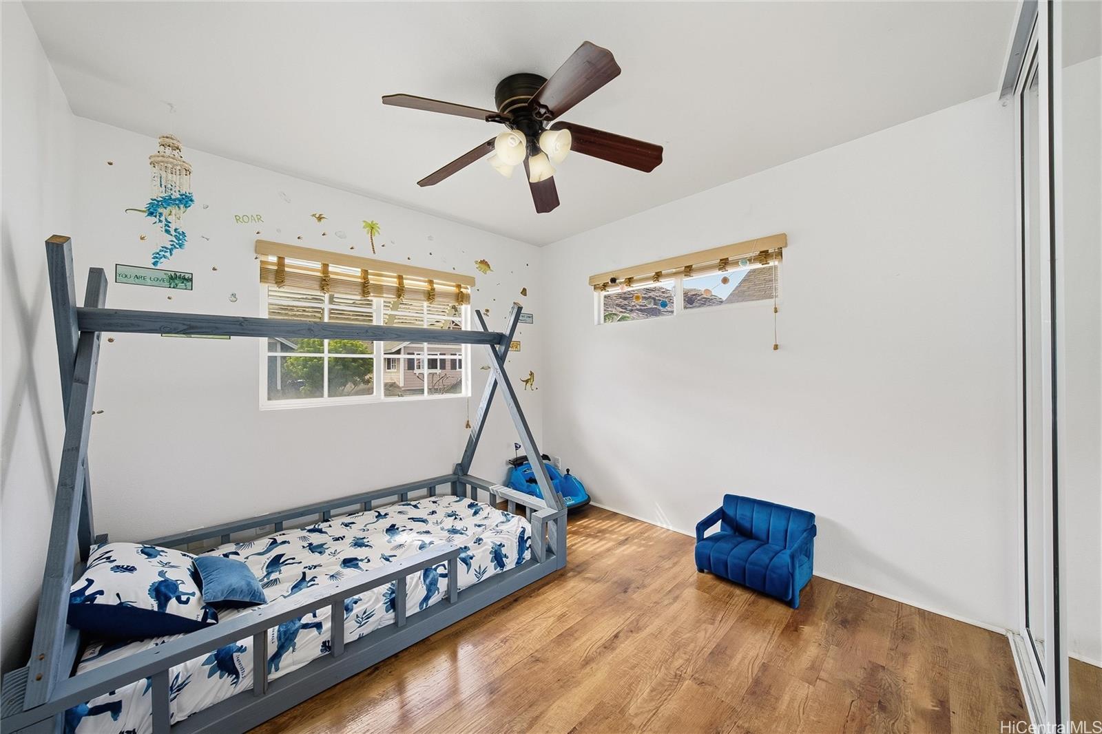 87-1958 Pakeke Street, Unit T Waianae, HI 96792 - Photo 21 of 25 a bedroom with bed and a window